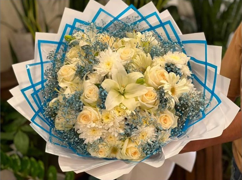 Cream and white rose and lily bouquet from Beirut Flowers