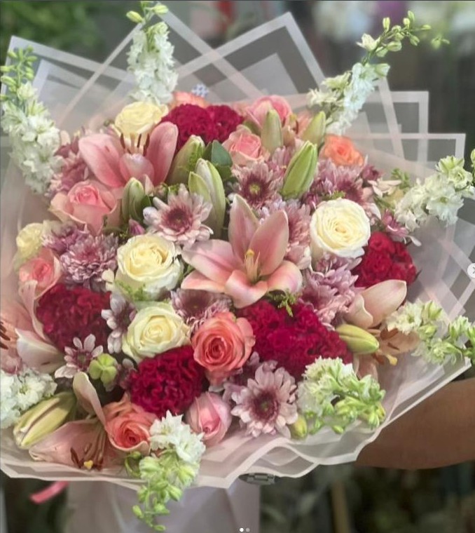 Pink and burgundy mixed rose, lily and carnation bouquet from Beirut Flowers